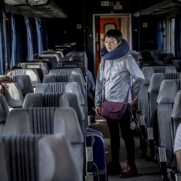 A passenger stretches her legs on the long trip from Serbia to Hungary. 