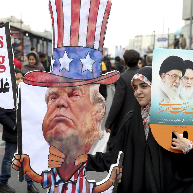 An Iranian woman holds an effigy of US President Donald Trump during a rally.