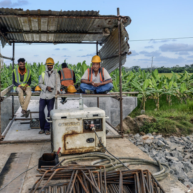Workers on an expressway developed by a Chinese company in Hambantota in 2018. Mahinda Rajapaksa spearheaded the project.