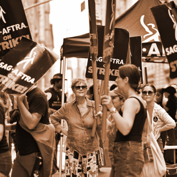 Actor Susan Sarandon, centre, joins a picket line outside the offices of Netflix and Warner Bros in New York City on July 19.