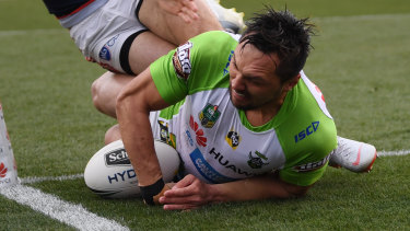 Jordan Rapana of the Raiders scores a try during the Round 23 NRL match between the Canberra Raiders and the Sydney Roosters at GIO Stadium in Canberra.
