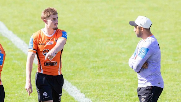 Lachie Galvin and coach Benji Marshall at Tigers training.
