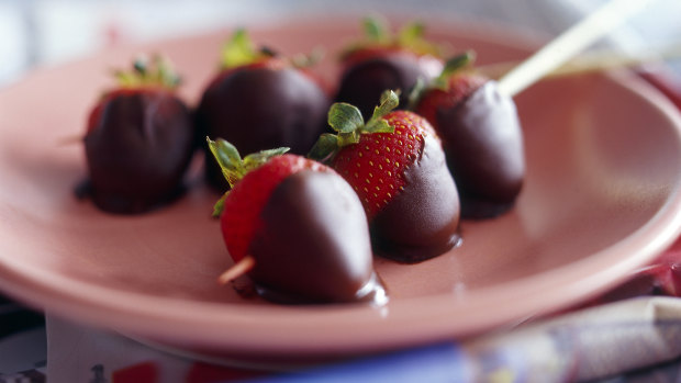 Chocolate-dipped strawberries fresh from the garden are one of life's simple pleasures.