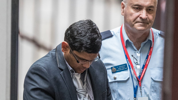 Arun Kamalasanan being led into court in February. 