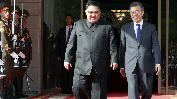 North Korea's Kim and South Korea's Moon at Saturday's surprise meeting.