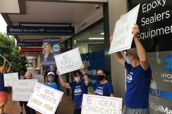 Supporters of independent candidate Larissa Penn outside Gladys Berejiklian’s electoral office during the campaign.