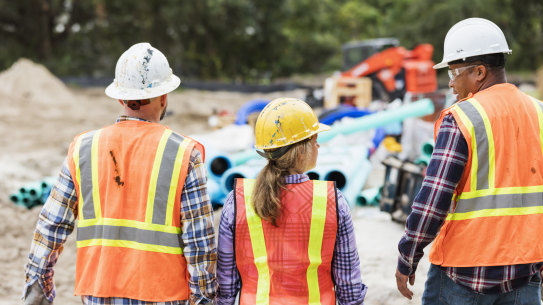 Government projects are guzzling workers needed for housing, the property industry lobby says. 