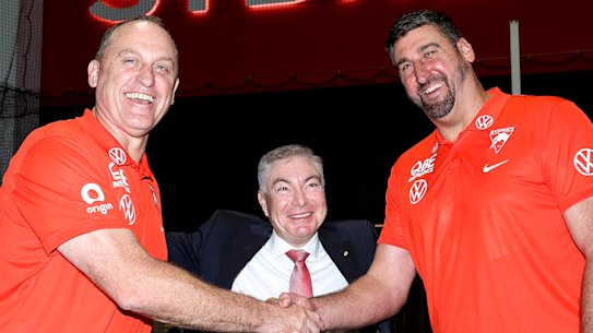 Swans chairman Andrew Pridham (centre) with ex-coach John Longmire (left) and his replacement Dean Cox.