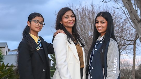 Poonam Singh with her daughters Kashvi and Prisha, who commute for more than ten hours a week - each - to get to and from their respective schools. 
