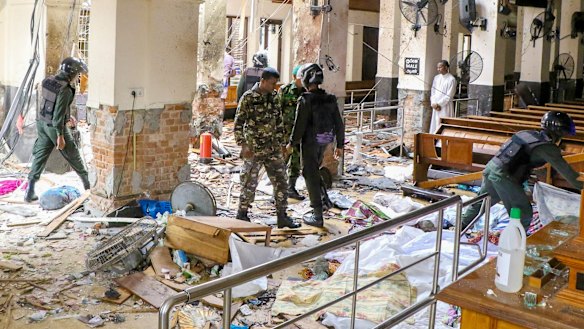 Security forces inspect the carnage after an explosion hit St Anthony's church in Kochchikade in Colombo, Sri Lanka.
