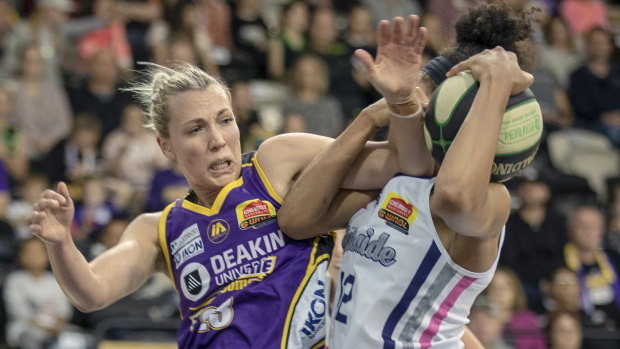 Rough and tumble: Melbourne’s Maddie Garrick and Adelaide’s Nia Coffee battle for control of the ball.