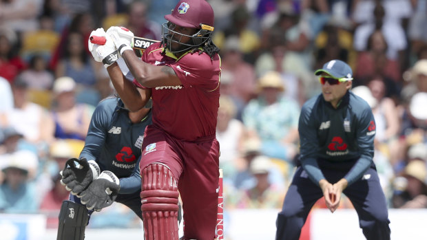 Hitting out: Chris Gayle smashes a six.