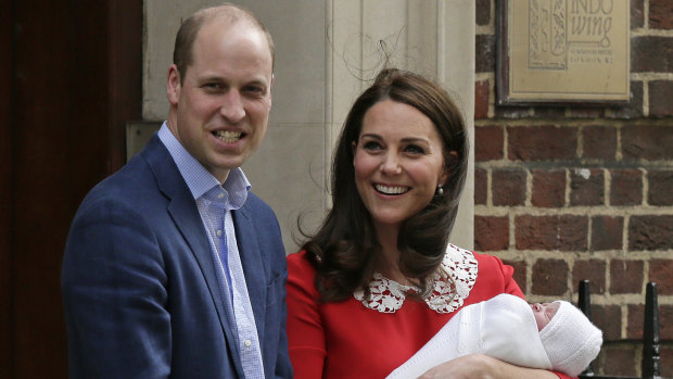 Prince William and Kate, Duchess of Cambridge smile as they hold their newborn baby son as they leave the Lindo wing at St Mary's Hospital in London on Monday, April 23.