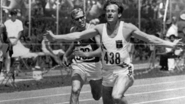 Speedster: Peter Norman breaks the tape in the 200m in Mexico City in 1968.