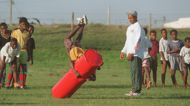 Wallabies player George Gregan looks on during a training session for children during the 1995 World Cup in Zwide township in Port Elizabeth, where current Springboks captain Siya Kolisi grew up. 