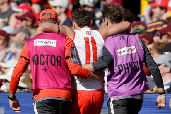 Tom Papley is helped off against the Lions on Sunday.