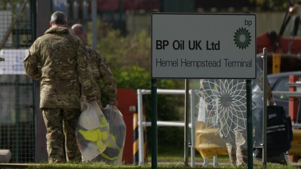 ‘Doing everything we can’: British army begins driving fuel trucks to stem shortage