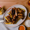 Henrietta’s charcoal chicken with condiments, bread and pickles.