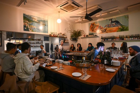 At La Pinta, diners gather around the U-shaped bar.