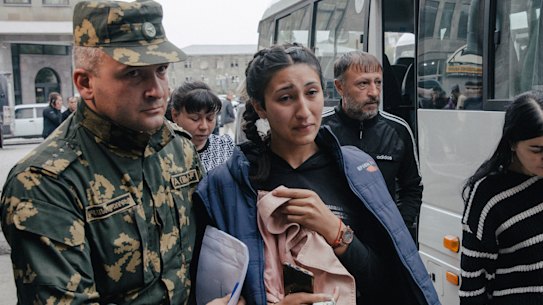 Ethnic Armenians arrive from Nagorno-Karabakh in Goris, Armenia, on Sunday.