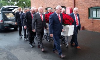 Johnny Raper's brothers and grandsons were pallbearers