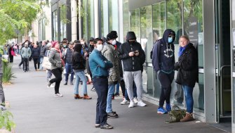People queue at Centrelink in March last year, before JobKeeper was announced to keep employees linked to their employers.