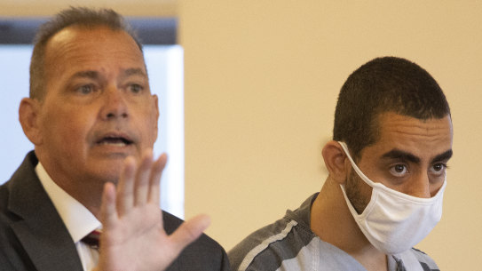 Hadi Matar, 24, (right) listens as defence attorney Nathaniel Barone speaks in court.