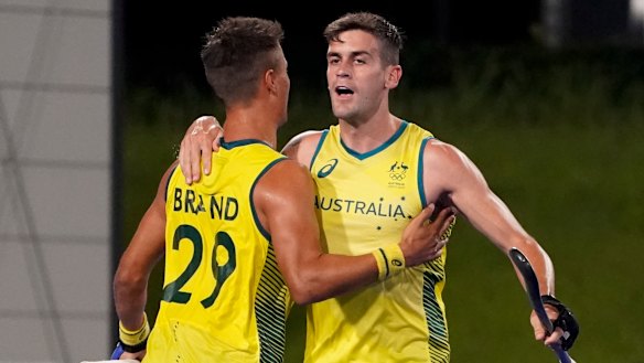 Blake Govers, right, has six goals in the first three games of the hockey tournament.