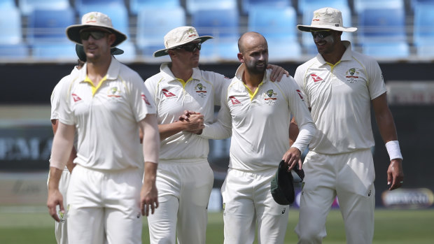 Nathan Lyon (second right) is planning a quiet night with his skipper.