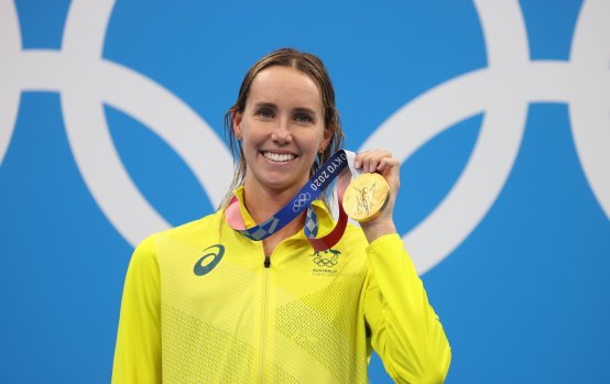 Emma McKeon with her 50m freestyle gold from Tokyo, one of a record seven medals she claimed in the Olympic pool.