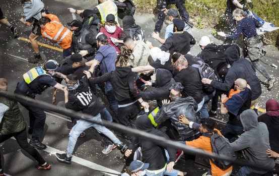 Anti-authority protesters clash with Victoria police at an anti-lockdown rally in Richmond.
