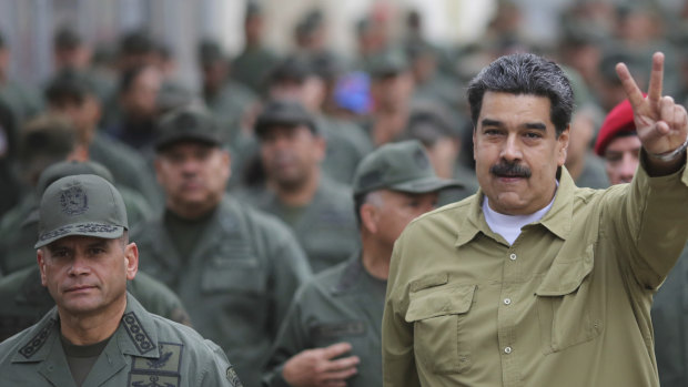 Venezuelan leader Nicolas Maduro, right, has stepped up his appearances with the military.