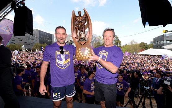 Amazing record: Cameron Smith and Craig Bellamy celebrate their title win in 2017.