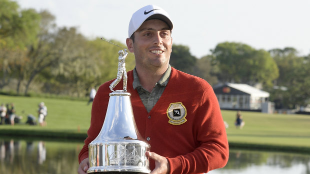 Molinari shows off the spoils of victory.