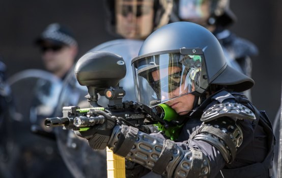 The specially equipped riot police have lightweight armour, helmets, riot shields and a range of weapons.