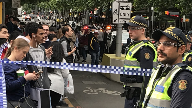 Police block off Bourke Street.