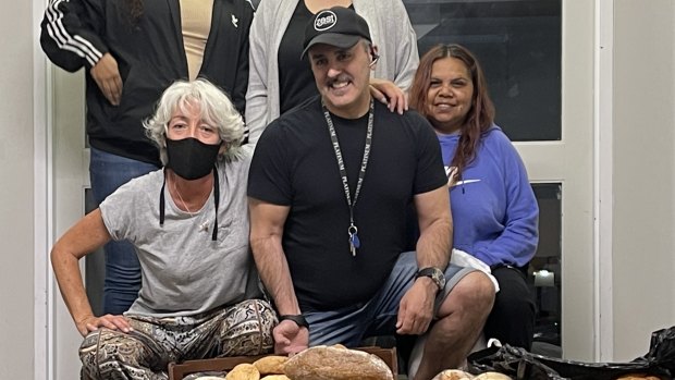 Perth City Apartment Hotel Eddie Kamil, centre, with bread used to feed his guests.  