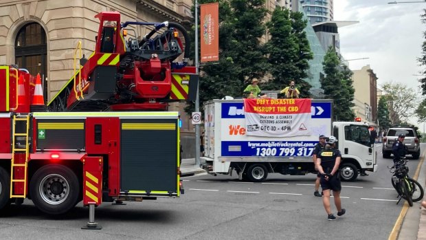 A fire truck with large cherry picker attachment was brought in to deal with the protest.