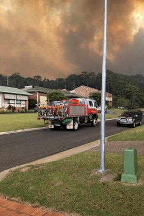 Bushfires associated with climate change can cause havoc in small communities frequented by holidaymakers, such as this fire in Tathra, NSW, in March 2018.