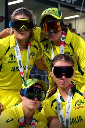 The Australian women’s team celebrates after defeating England in the World Cup final.