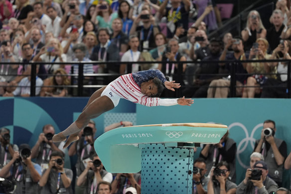 Simone Biles, of the United States, performs on the vault during the women’s artistic gymnastics team final.