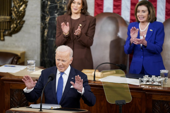 President Joe Biden delivers his State of the Union address as Vice President Kamala Harris and then-Speaker of the House Nancy Pelosi look on.