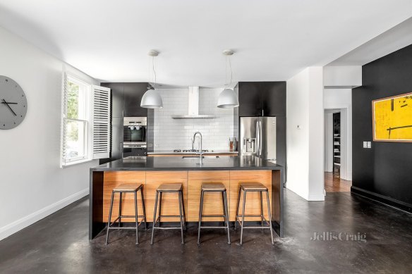 The property has a spacious and light-filled modern kitchen.