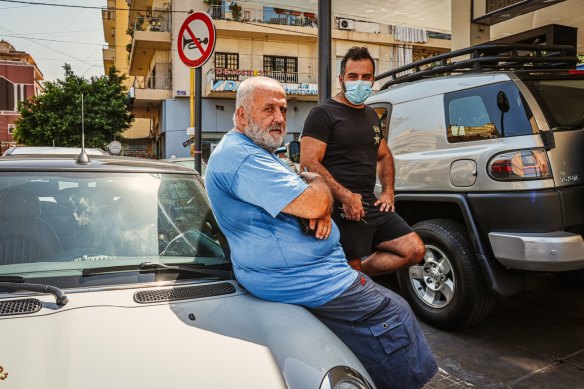 Romeo Khalil waits hours for fuel so he can still work as a taxi driver.