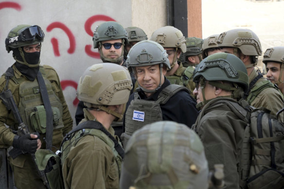 Israeli Prime Minister Benjamin Netanyahu receives a security briefing in the northern Gaza Strip on December 25.