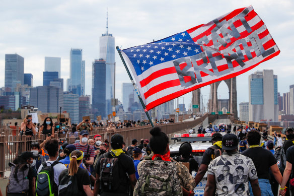 Protesters march across the Brooklyn Bridge in New York.