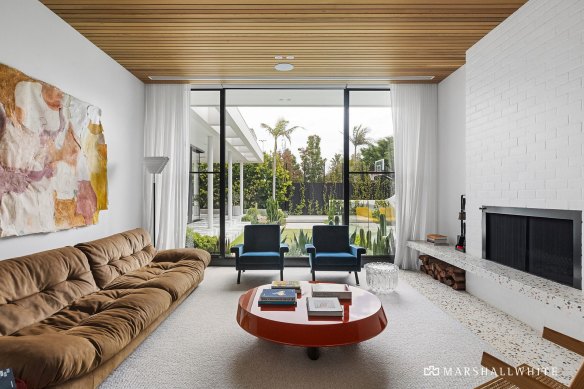 The sunken den includes a cedar timber ceiling.