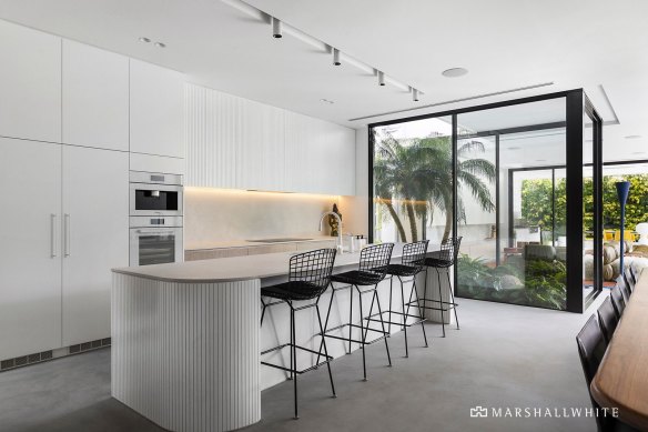 An internal courtyard and floor-to-ceiling windows let in plenty of natural light.