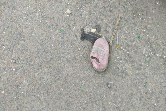 A shoe left outside the stadium, which was engulfed in panic and violence on Saturday night.