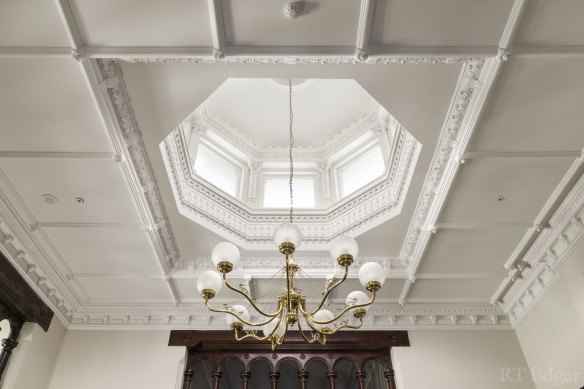 Period details include the decorative ceilings and domed skylight.